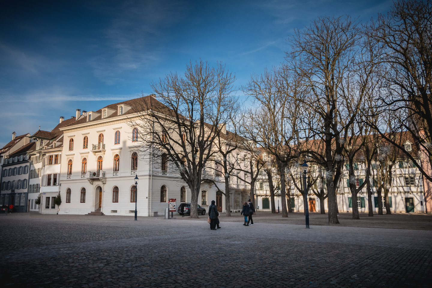 Warmly dressed people walk on cathedral square of Basel iStock 1060604004 24