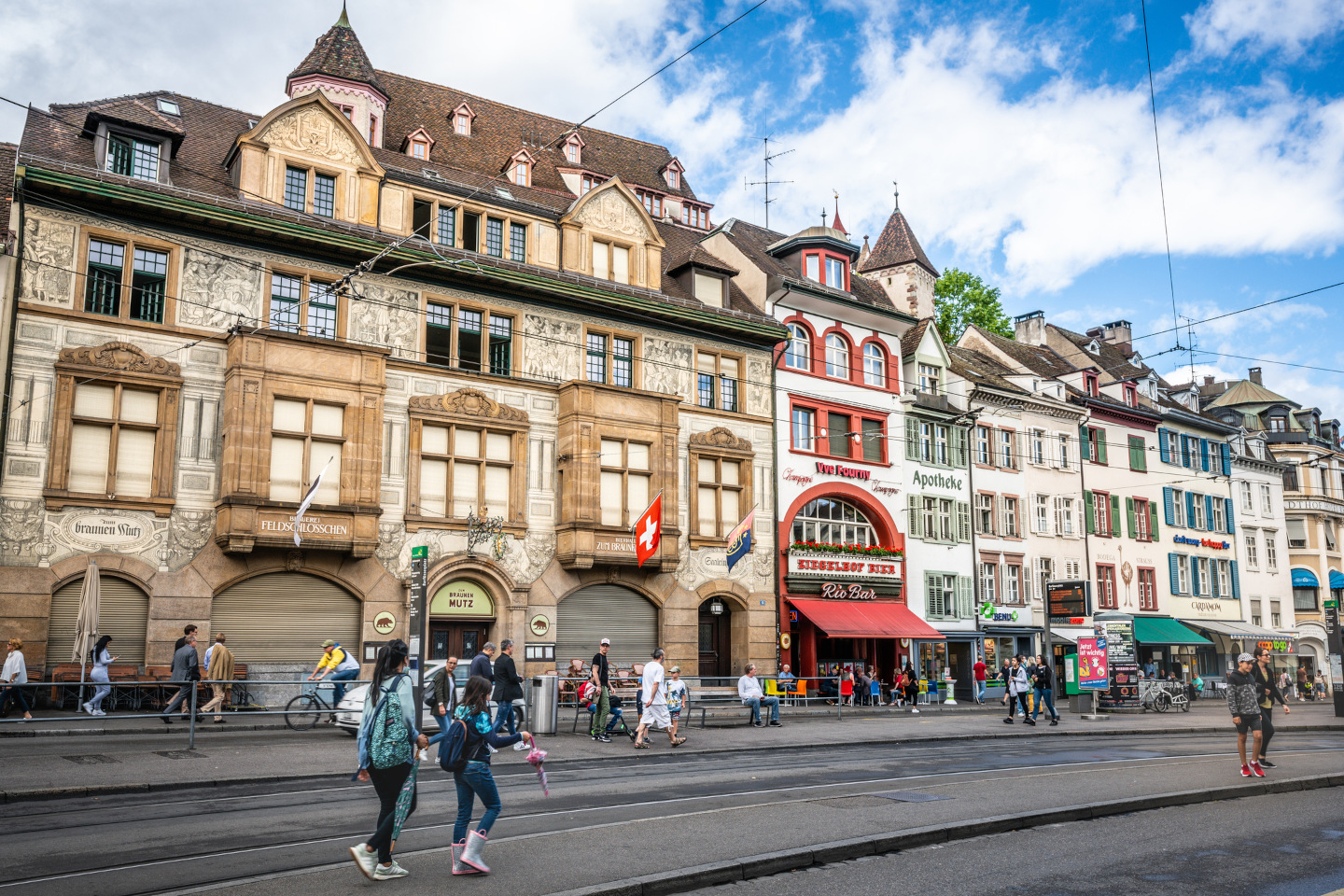 Basel cityscape with colourful old houses on Barfusserplatz square and people in Basel Switzerland iStock 1268691937 24