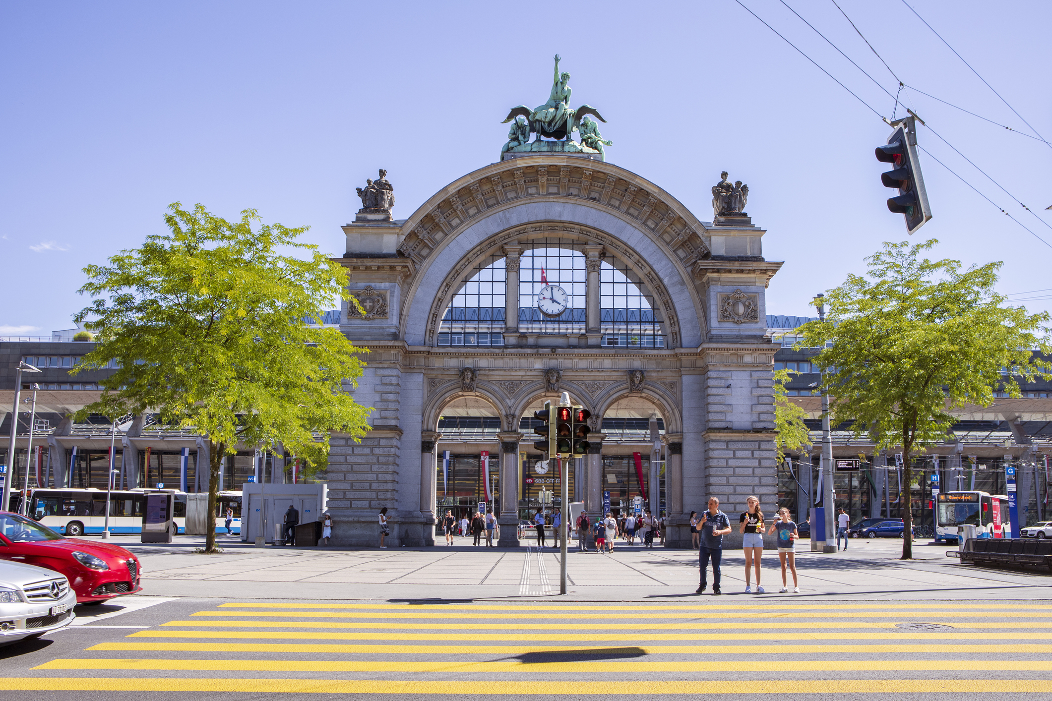 Main Railway Station in Lucerne, zebra crossing, city traffic. Switzerland. iStock 1271210970 6