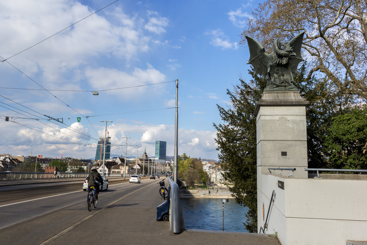 Wettstein Bridge with basilisk bronze figure at one end of the bridge, Basel, Switzerland. iStock 1312686201 24