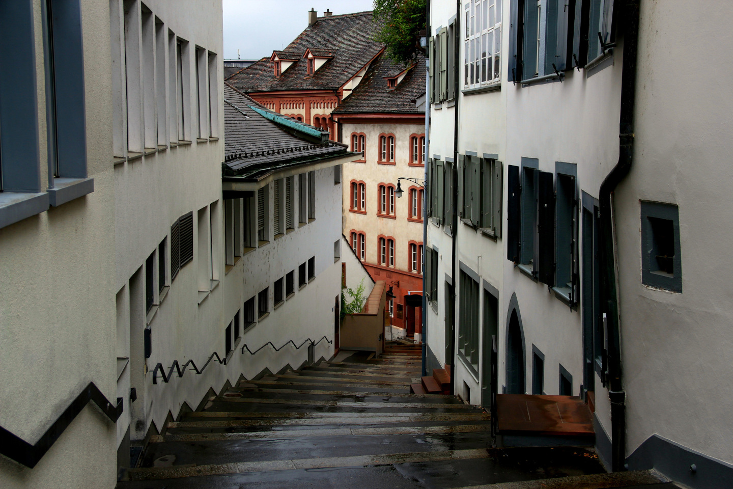 A narrow street with stairs in the historic center of the city of Basel in northern Switzerland iStock 1439756678 24